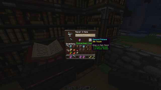 Un pequeño menú cuadrado que muestra un toque de seda sobre un libro abierto. 