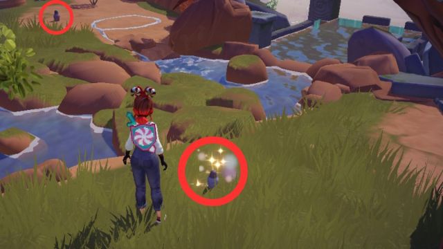 Muñecas Matryoshka encontradas en el entorno de la meseta iluminada por el sol del valle de Disney Dreamlight con un círculo rojo alrededor.