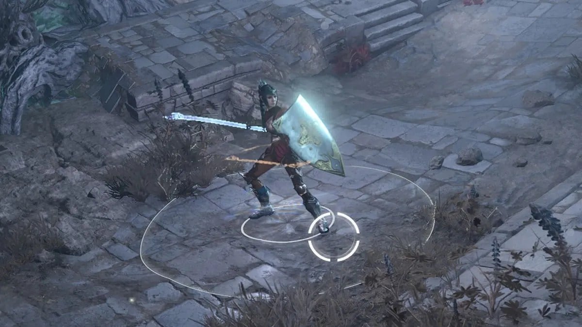 Mujer de pelo oscuro con armadura, escudo y bastón.