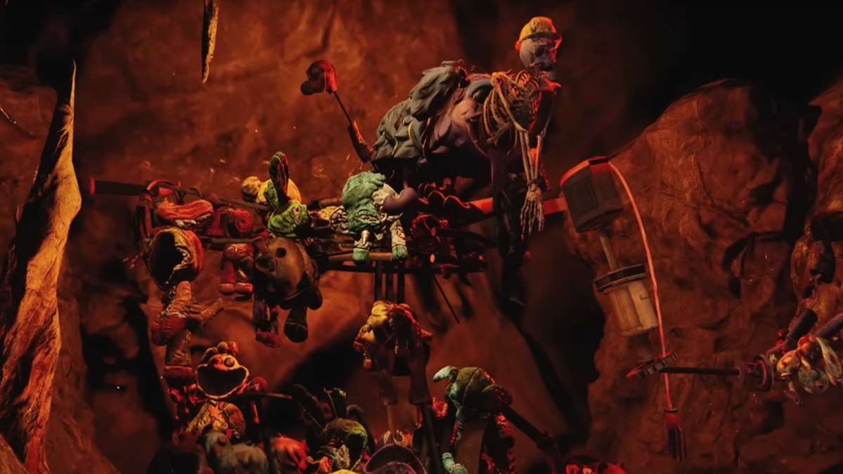 La escultura de CatNap de juguetes rotos y un esqueleto