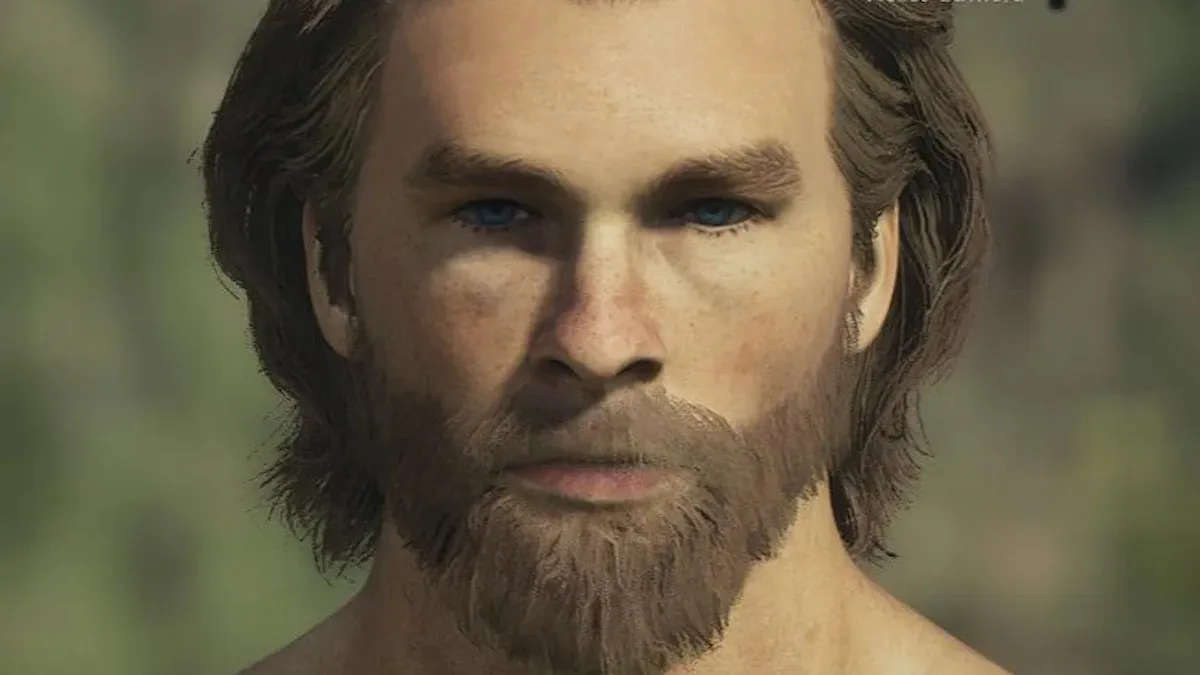 Primer plano de un personaje que se parece a Thor de Marvel, cabello rubio sucio hasta las orejas y una barba a juego.  Ojos azules intensos y figura musculosa.
