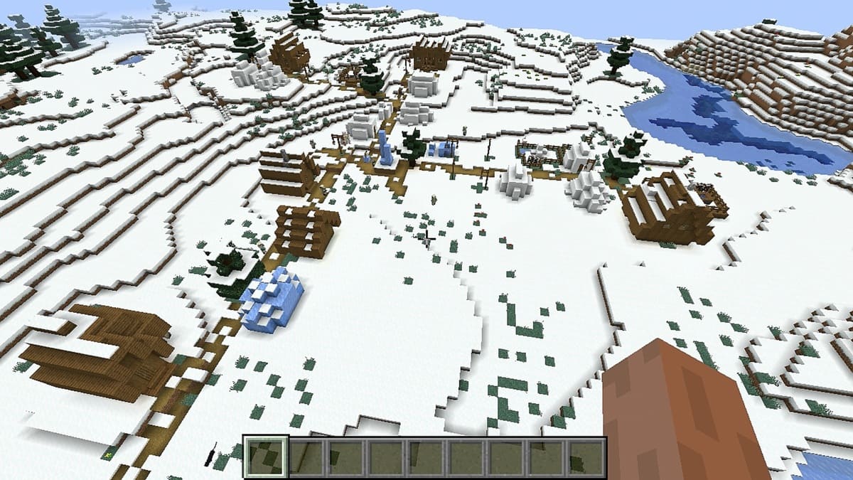 Llanuras nevadas y pueblo en Minecraft