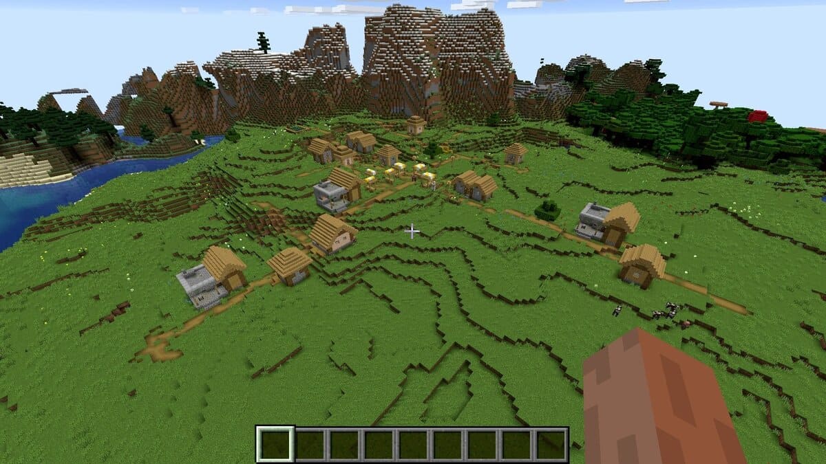 Tres herreros y pueblo en Minecraft.