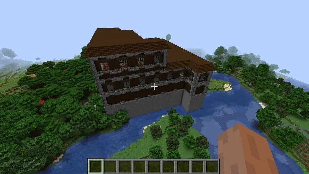 Mansión en el bosque junto al río en Minecraft