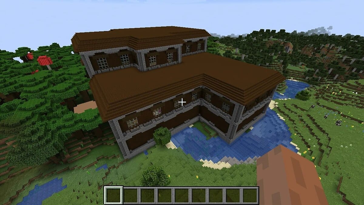 Mansión en el bosque junto al río en Minecraft