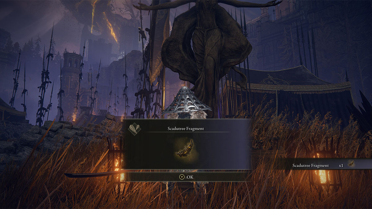 Fragmento de Scadutree en el campamento frente al Castillo Ensis en Elden Ring Shadow of the Erdtree